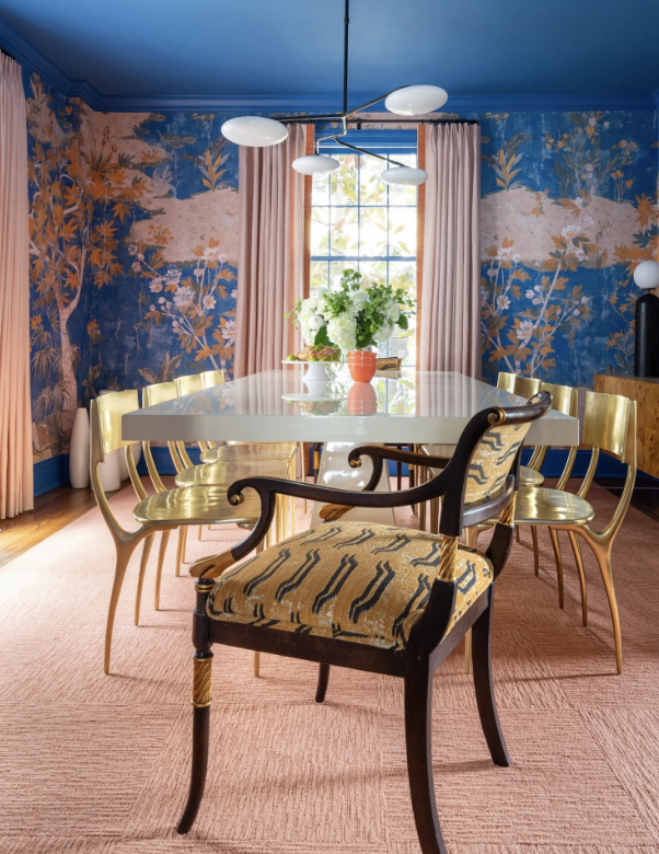 blue, white, and pink dining room, chinoiserie wallpaper, visual comfort lighting, with custom chrome bar rods and a marble counter top. blue and white Jennifer Shorto horse wallpaper adorns the walls of a wet bar leading into a blue and pink dining room by jewel Marlowe. Luxury design, colorful design, famous designer, washington dc, virginia, maryland